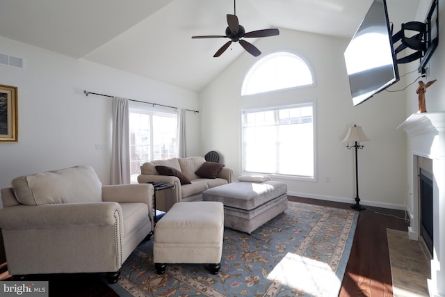 148 Gemstone Dr, Bellefonte, PA 16823 - living area featuring high vaulted ceiling, a fireplace with flush hearth, wood finished floors, visible vents, and ceiling fan