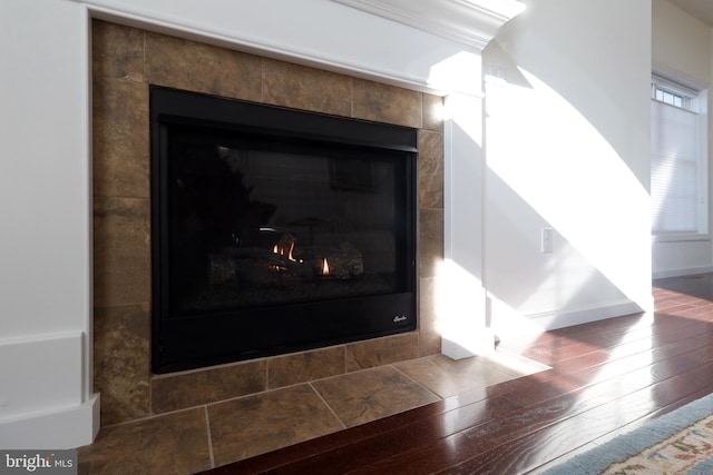 148 Gemstone Dr, Bellefonte, PA 16823 - interior details with baseboards, a tile fireplace, and wood finished floors
