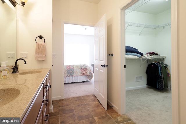 148 Gemstone Dr, Bellefonte, PA 16823 - full bath with ensuite bathroom, double vanity, a sink, and a walk in closet