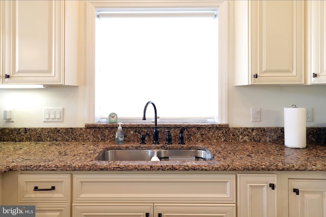 148 Gemstone Dr, Bellefonte, PA 16823 - kitchen featuring plenty of natural light, white cabinets, a sink, and dark stone counters