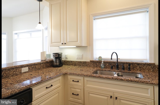 148 Gemstone Dr, Bellefonte, PA 16823 - kitchen with white cabinetry, decorative light fixtures, a sink, and dark stone counters