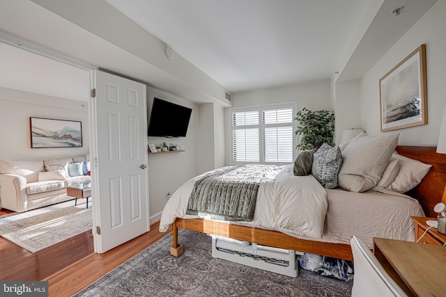 bedroom with wood finished floors