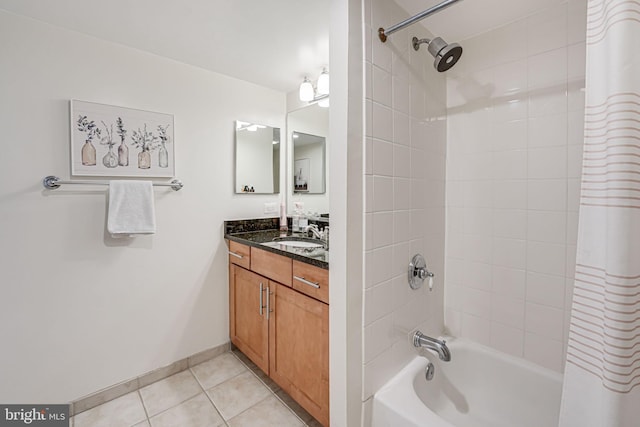 full bathroom featuring tile patterned flooring, shower / bathtub combination with curtain, baseboards, and vanity