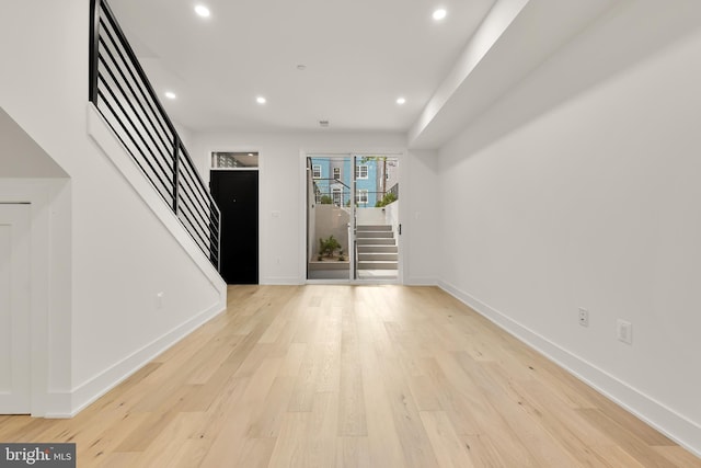 foyer entrance with light hardwood / wood-style floors