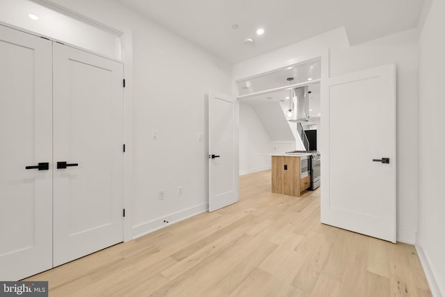 bedroom featuring a closet and light hardwood / wood-style flooring