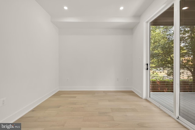 unfurnished room featuring light hardwood / wood-style flooring