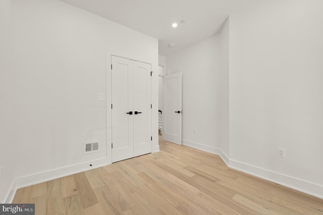 empty room with light hardwood / wood-style floors