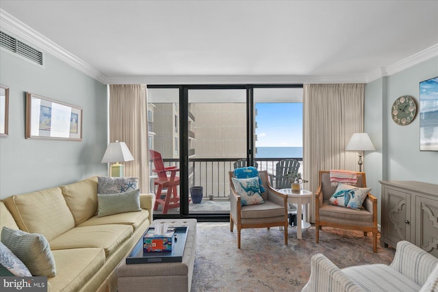 living room featuring floor to ceiling windows, crown molding, and a water view