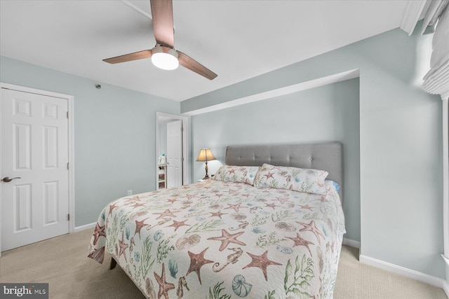 carpeted bedroom featuring ceiling fan