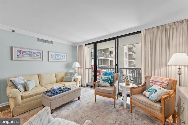 living room featuring a wall of windows and crown molding