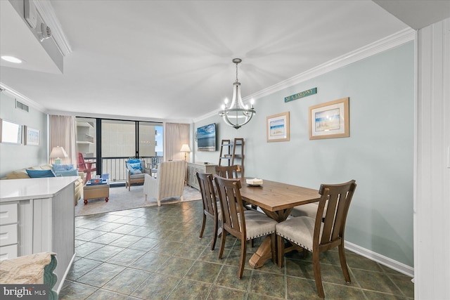 dining room with ornamental molding and an inviting chandelier