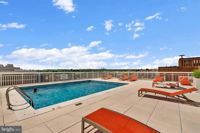 view of pool featuring a patio area