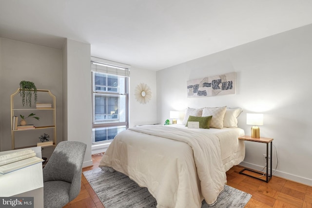 bedroom with parquet flooring