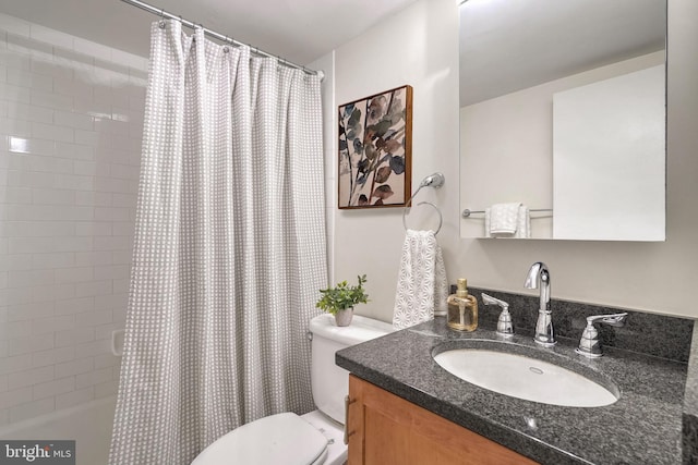 full bathroom featuring vanity, shower / tub combo, and toilet