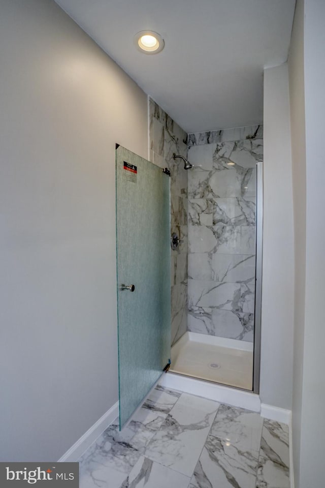 bathroom with tiled shower