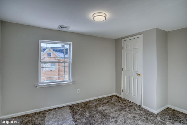 spare room with carpet floors