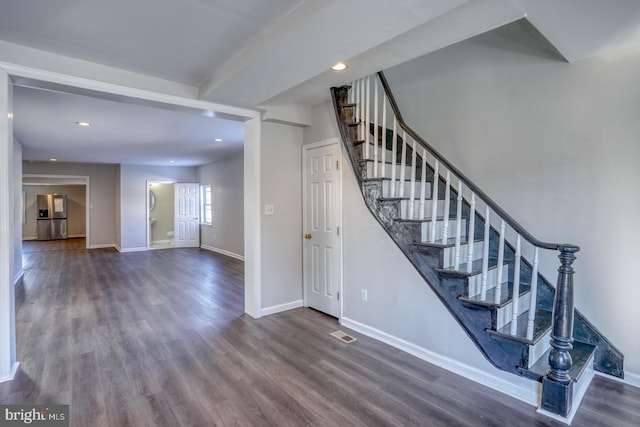 stairway with hardwood / wood-style floors