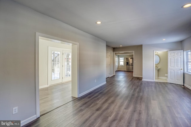 empty room with dark wood-type flooring