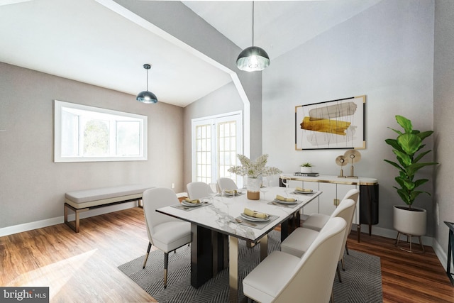 dining space featuring dark hardwood / wood-style flooring and vaulted ceiling