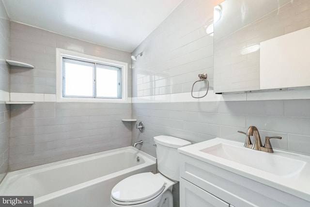 full bathroom with toilet, tile walls, vanity, backsplash, and tiled shower / bath