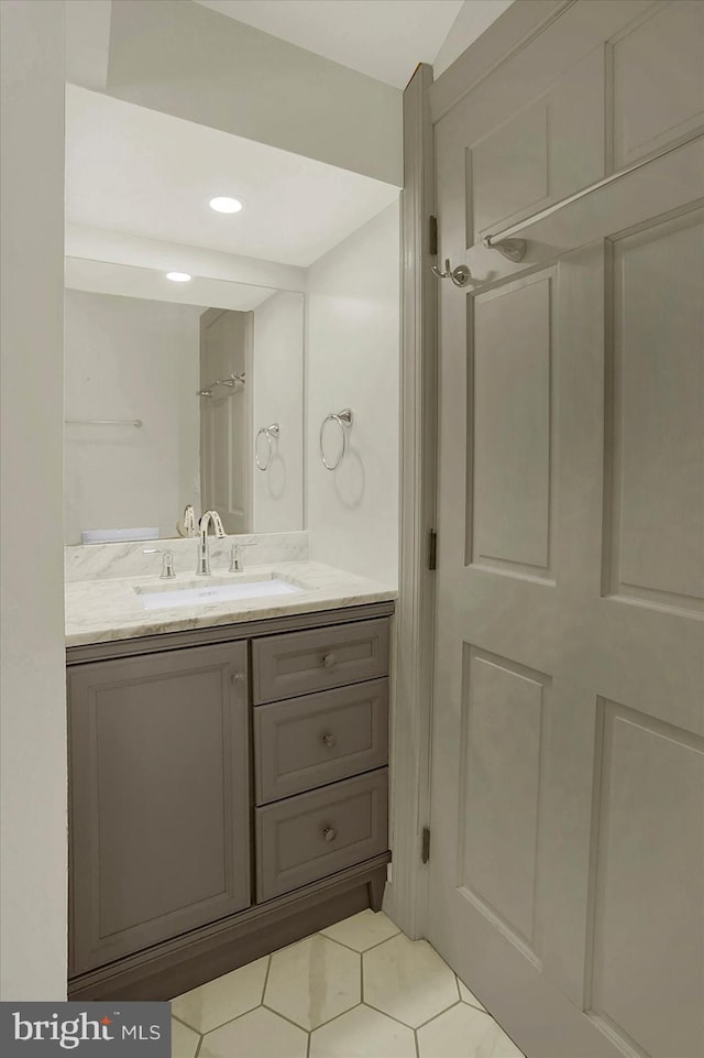 bathroom featuring vanity and curtained shower