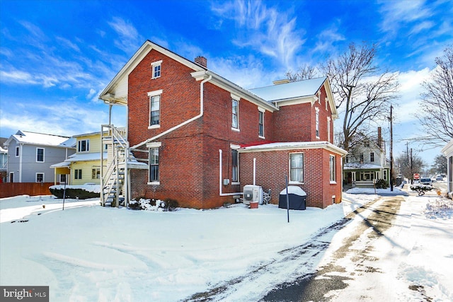 view of snow covered property