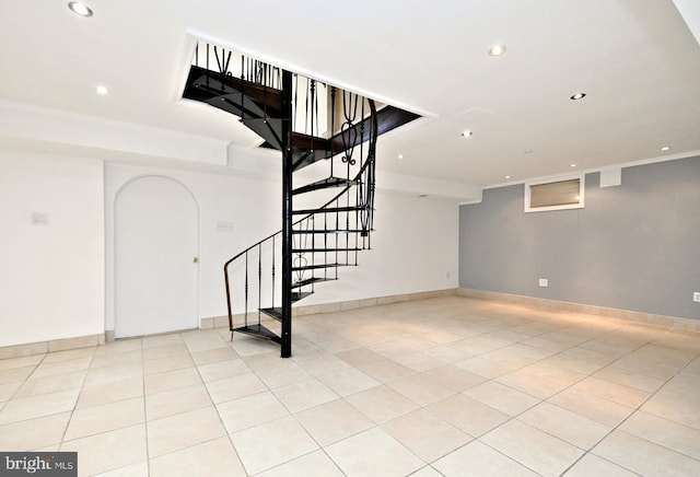 basement featuring light tile patterned flooring