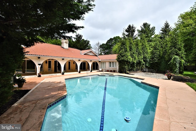 view of swimming pool with a patio