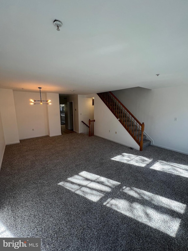 unfurnished living room featuring carpet