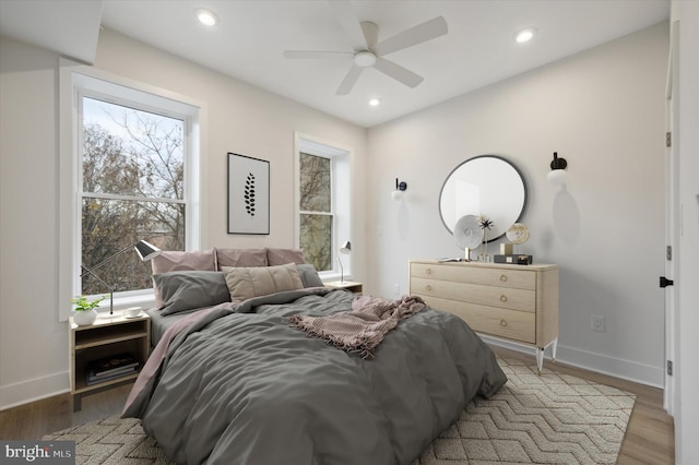 bedroom with light wood-type flooring and ceiling fan