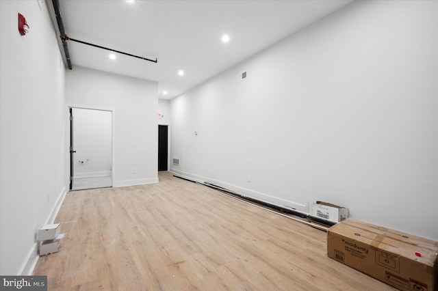 spare room featuring light hardwood / wood-style floors