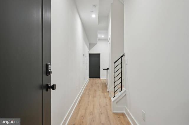 hall with light hardwood / wood-style flooring