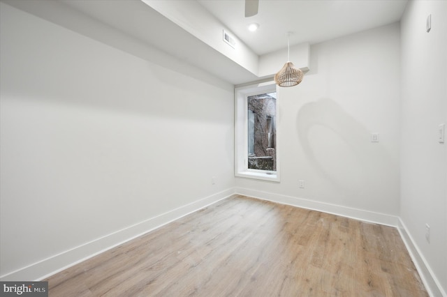 spare room featuring light hardwood / wood-style floors