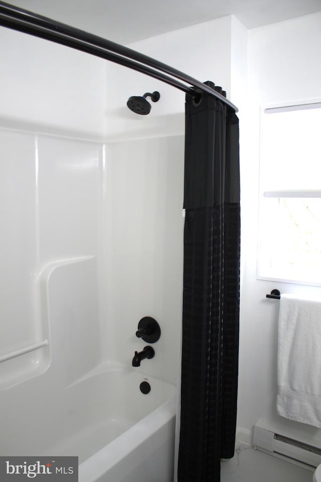 bathroom with a baseboard radiator and shower / bath combo