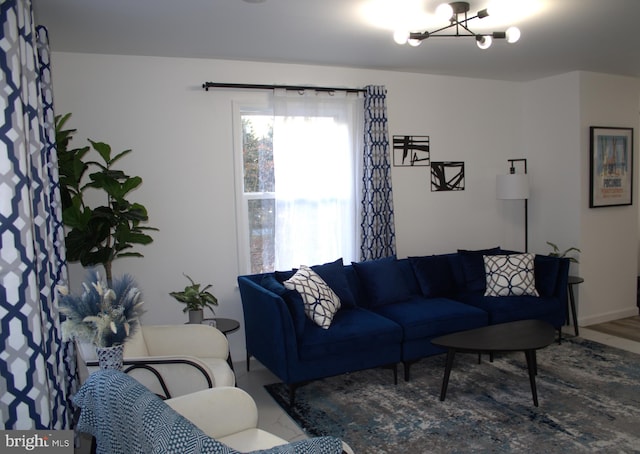 living room with an inviting chandelier