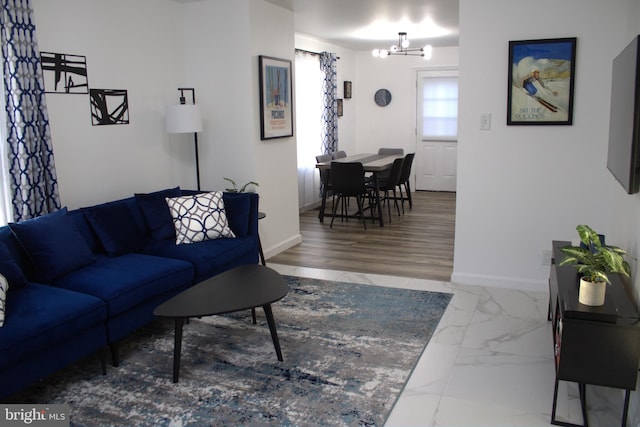 living room featuring an inviting chandelier