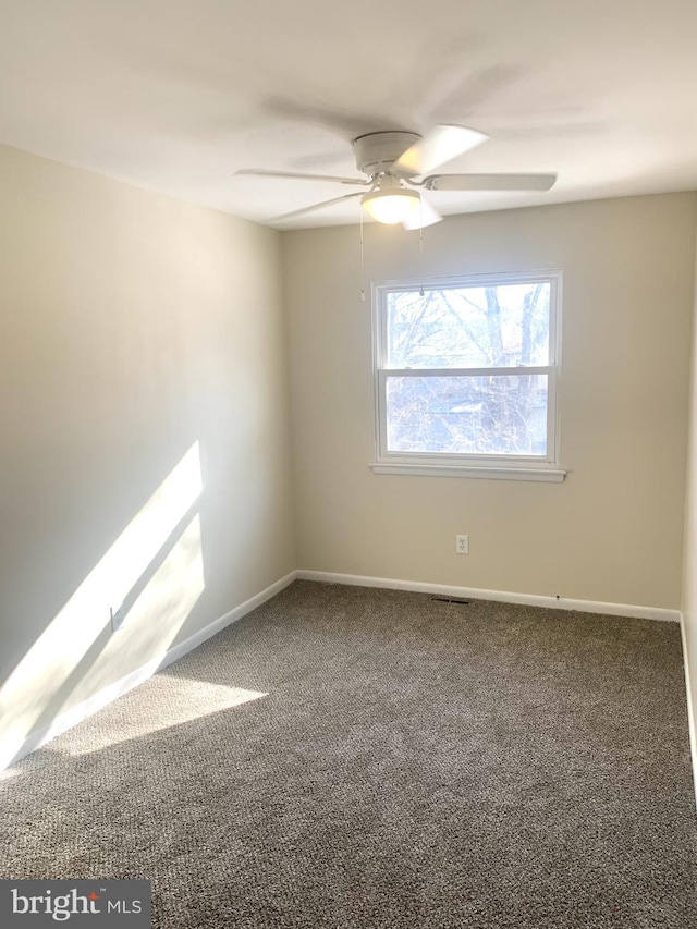 empty room with carpet floors and ceiling fan