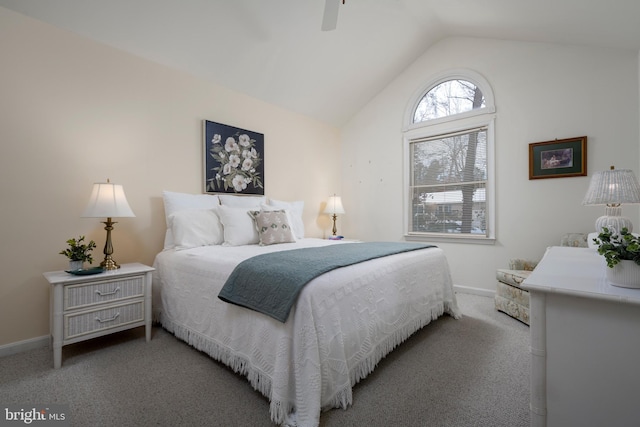 bedroom with ceiling fan, light colored carpet, and lofted ceiling