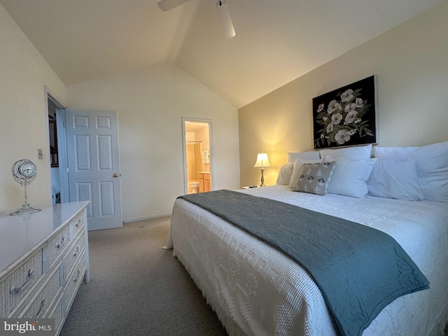 carpeted bedroom featuring connected bathroom, vaulted ceiling, and ceiling fan