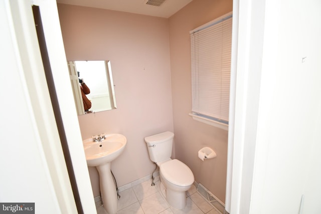 bathroom featuring tile patterned floors and toilet