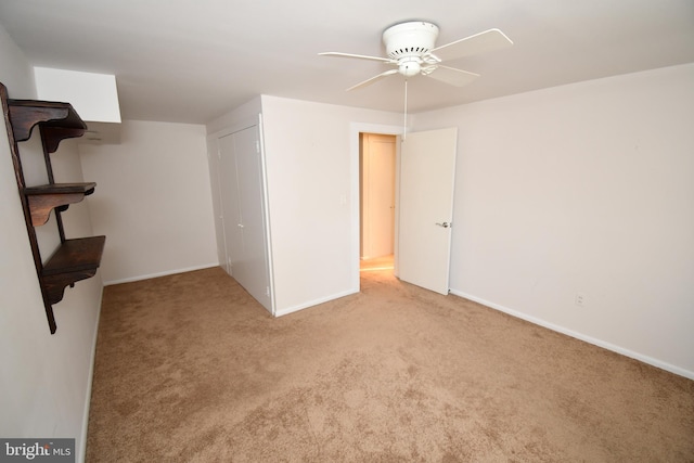 interior space with ceiling fan