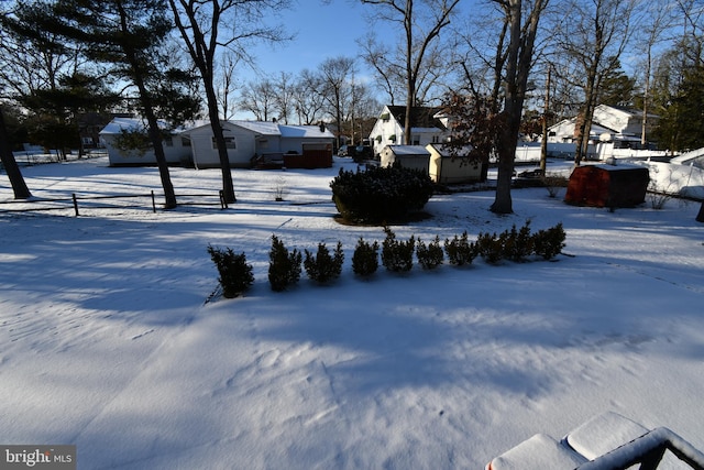 view of yard covered in snow