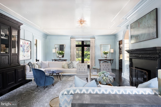 living room featuring dark hardwood / wood-style flooring, crown molding, and french doors