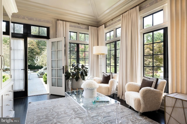 doorway to outside with vaulted ceiling, dark wood-type flooring, and crown molding