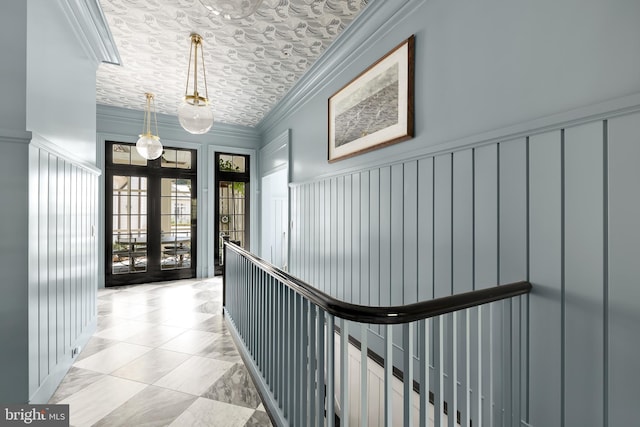 corridor featuring ornamental molding and french doors