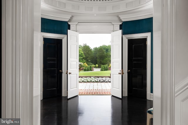 interior space featuring dark hardwood / wood-style flooring and crown molding