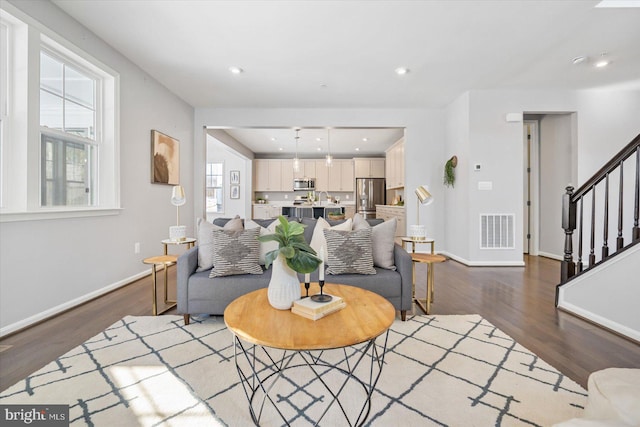 living room with wood-type flooring