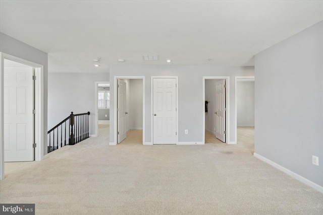 spare room with light colored carpet