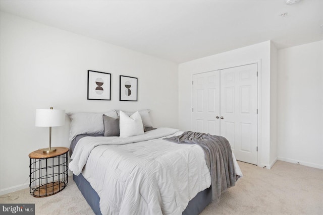 carpeted bedroom with a closet