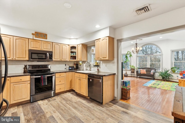 kitchen featuring light wood-type flooring, stainless steel appliances, light brown cabinets, and sink